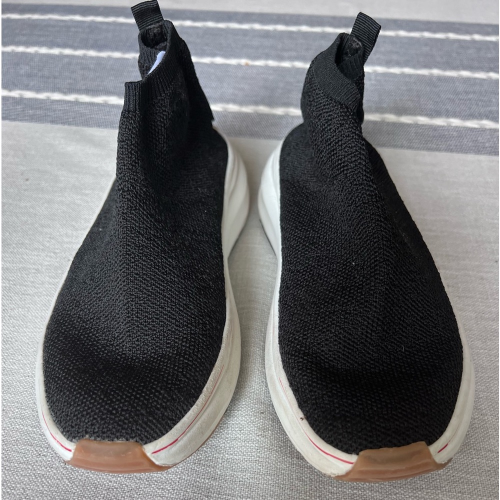 Black nylon stretch slip on sneaker with Minnie Mouse face logos.